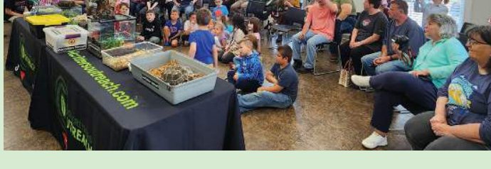 Families and children at a Cool Critter Outreach animal education event